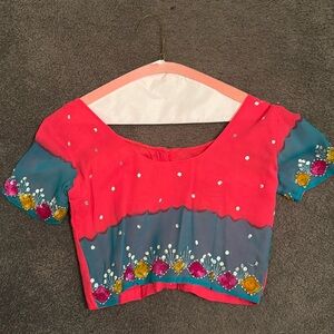 Bright pink/blue/yellow saree.